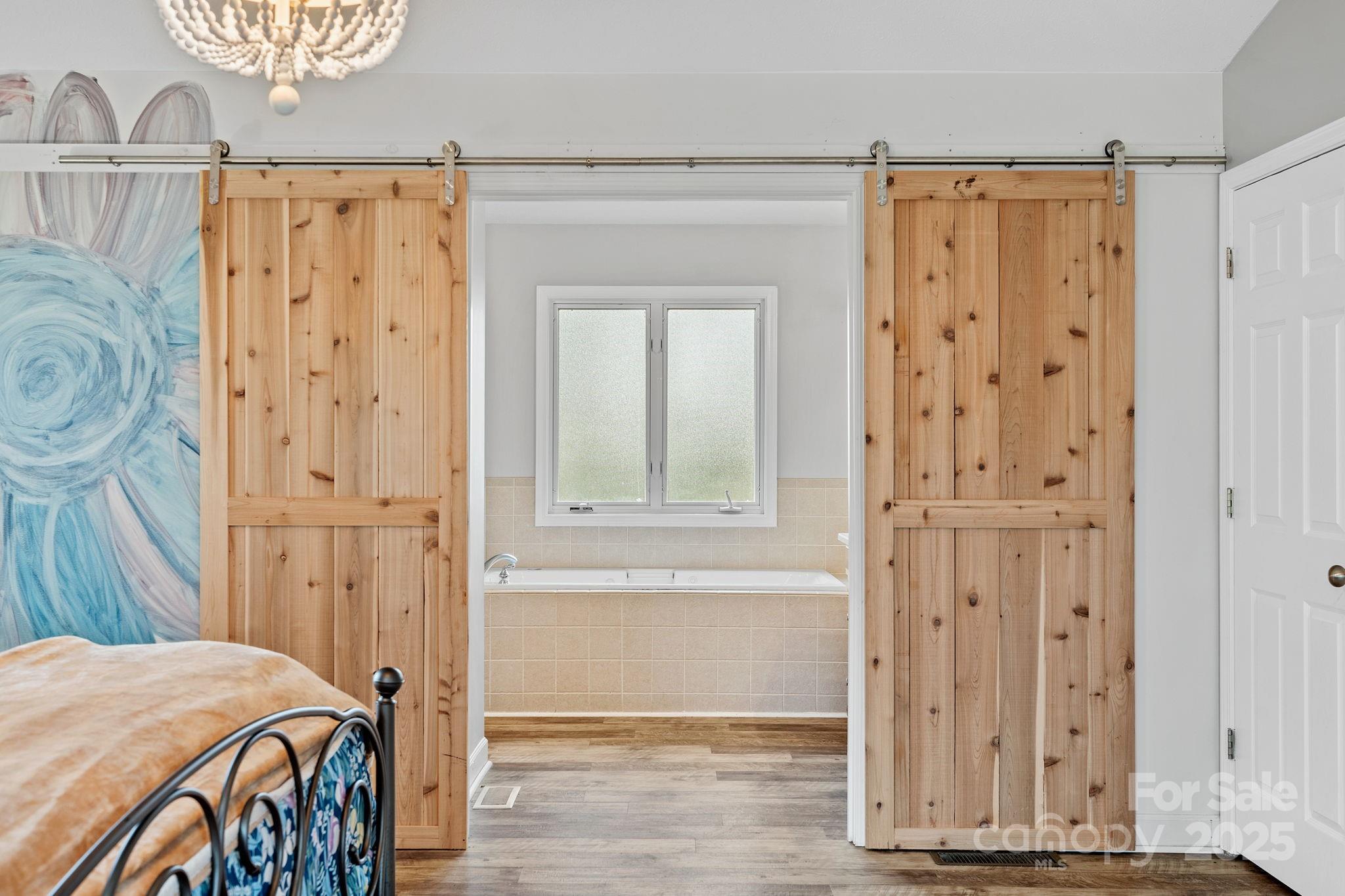 21 Presbyterian Church Road Mills River, NC 28759 - Photo 22 of 48 a view of a bedroom with wooden floor