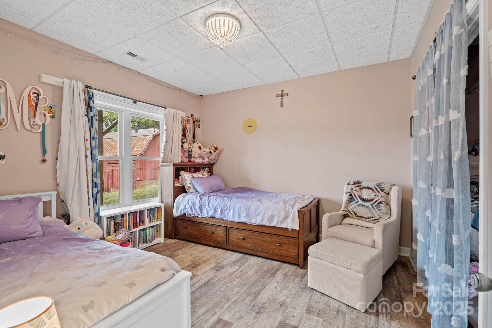 21 Presbyterian Church Road Mills River, NC 28759 - Photo 30 of 48 a bedroom with a bed couch and a window