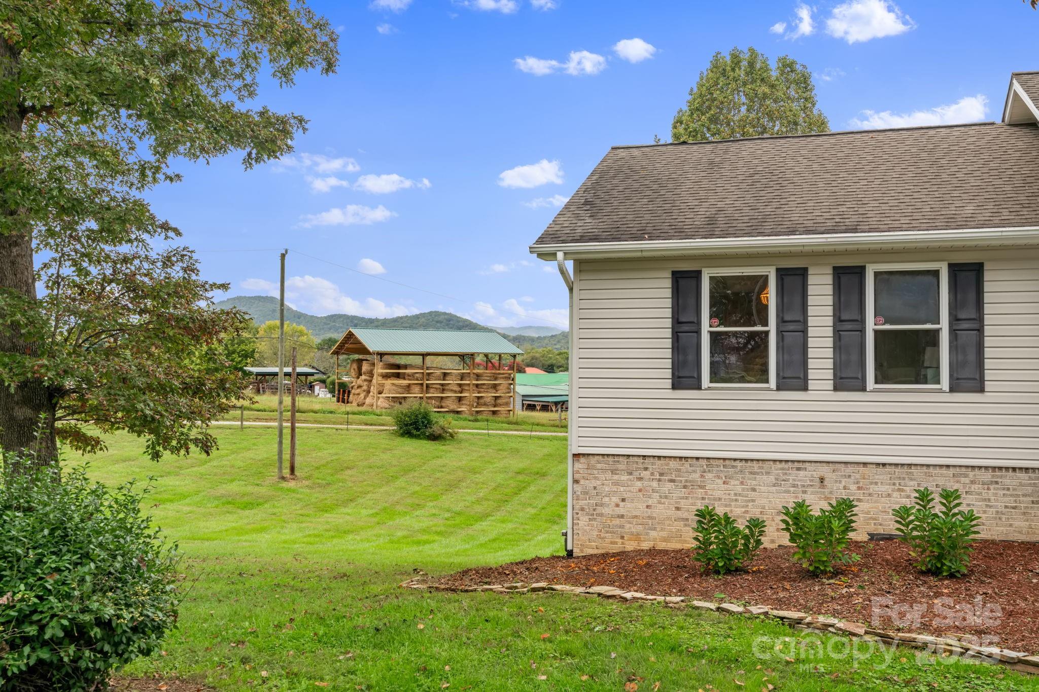 21 Presbyterian Church Road Mills River, NC 28759 - Photo 45 of 48 a view of a house with a yard