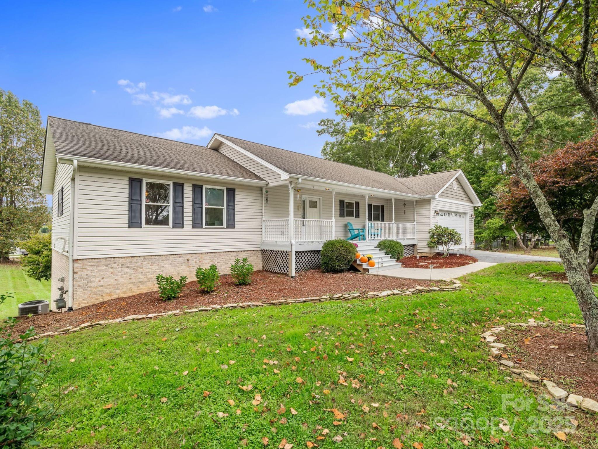 21 Presbyterian Church Road Mills River, NC 28759 - Photo 48 of 48 a front view of a house with garden and porch