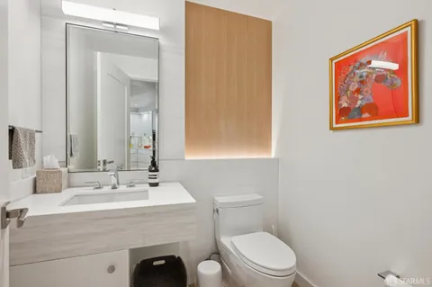 a bedroom with a large bed and a large window