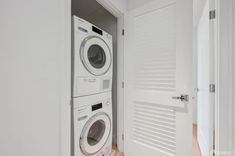 a bathroom with a double vanity sink mirror double shower and a toilet