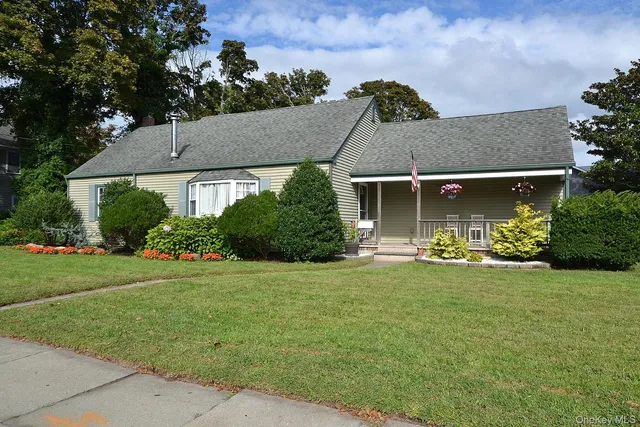 front view of a house with a garden