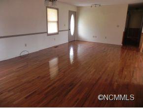 145 Hightower Road Forest City, NC 28043 - Photo 2 of 14 a view of a room with wooden floor and window