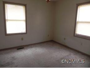 145 Hightower Road Forest City, NC 28043 - Photo 7 of 14 an empty room with a window