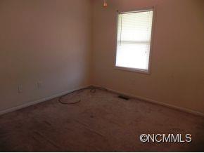 145 Hightower Road Forest City, NC 28043 - Photo 8 of 14 an empty room with a window