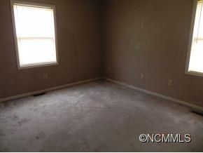 145 Hightower Road Forest City, NC 28043 - Photo 9 of 14 an empty room with a window