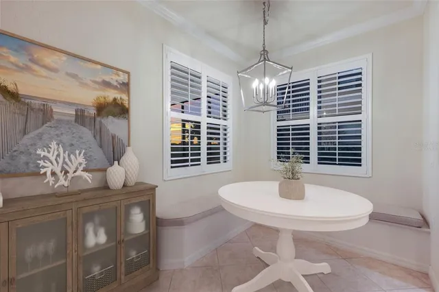 a kitchen with granite countertop white cabinets stainless steel appliances and a sink