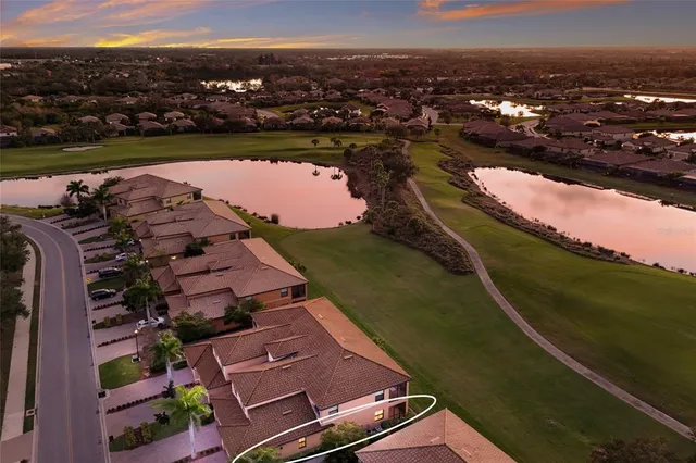 a view of yard with swimming pool and green space