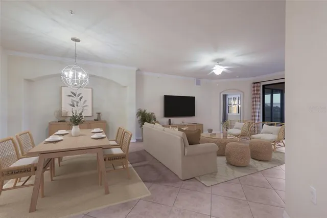 a living room with furniture a table and chairs