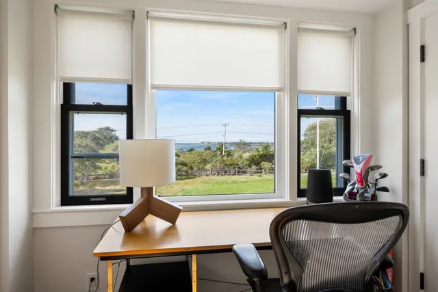 a bed room with a bed and a chair