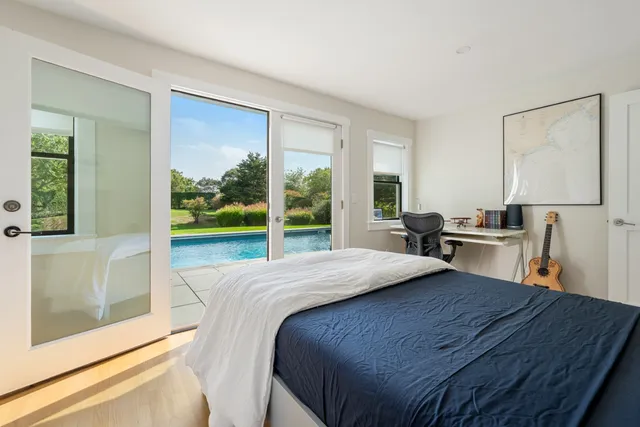 a view of balcony with furniture and wooden floor