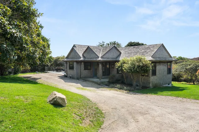 a large kitchen with a table and chairs