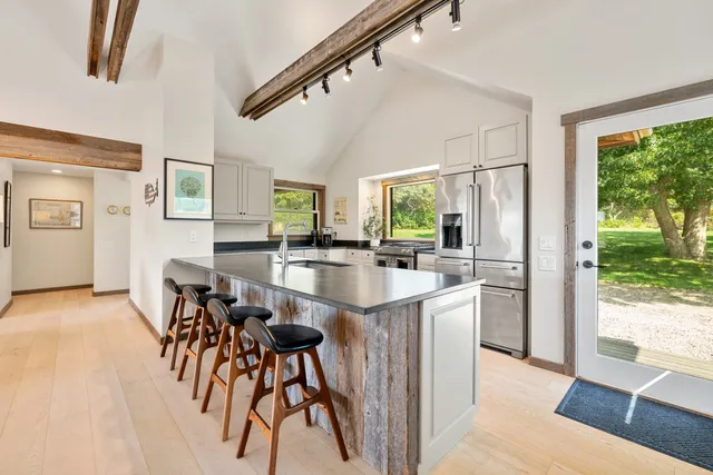 a kitchen with sink and cabinets
