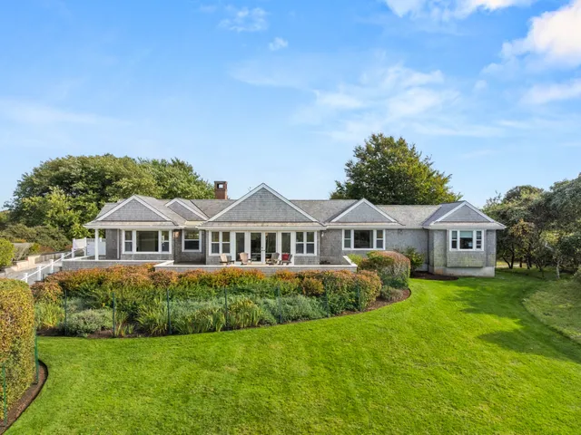 a view of a terrace with wooden floor and outdoor seating