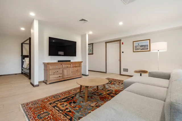 a bedroom with a large bed and a large window