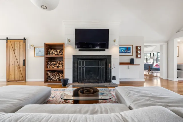 a kitchen with granite countertop a table chairs stove and cabinets