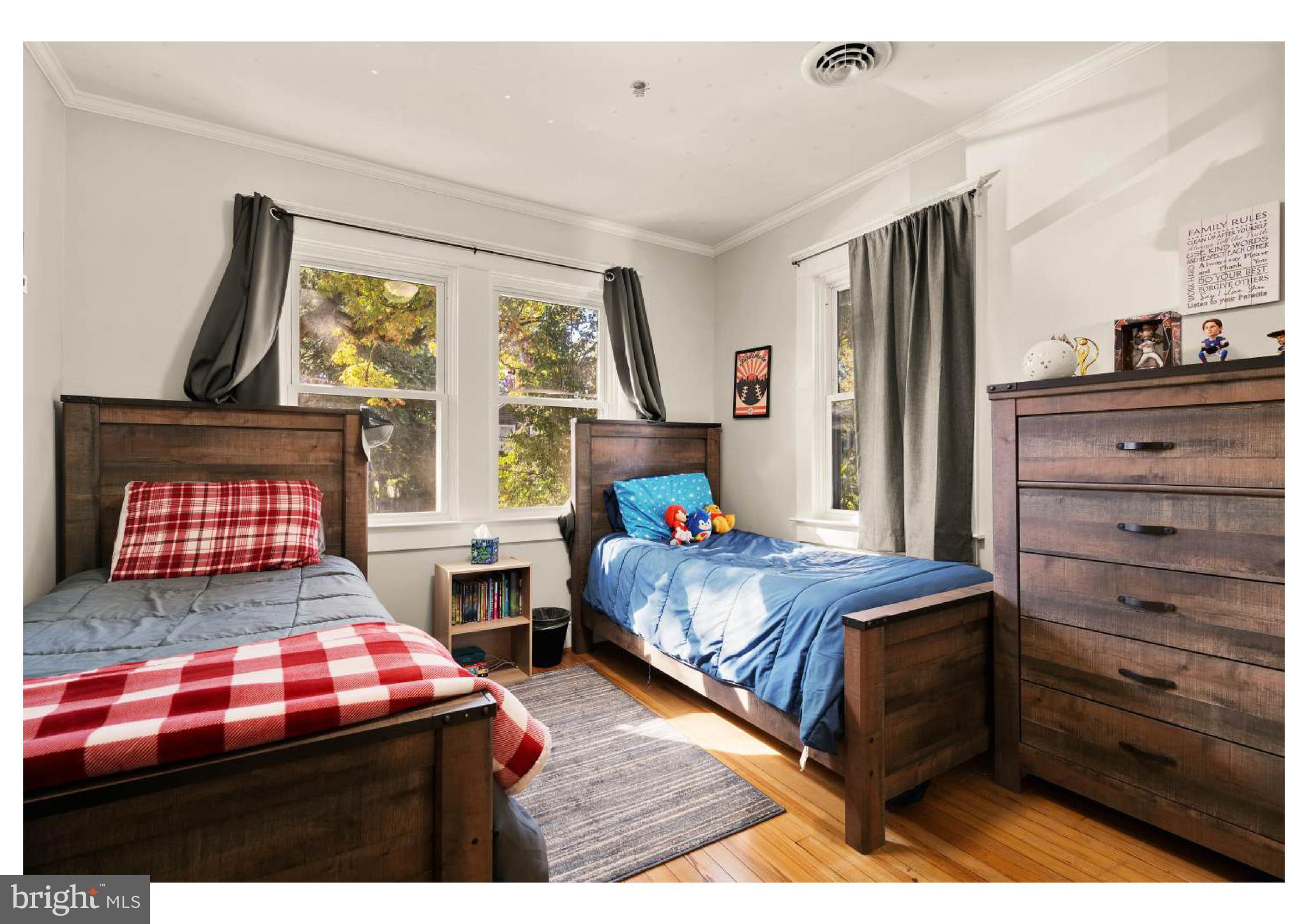 610 St Dunstans Road Baltimore, MD 21212 - Photo 22 of 44 a bedroom with two beds and window