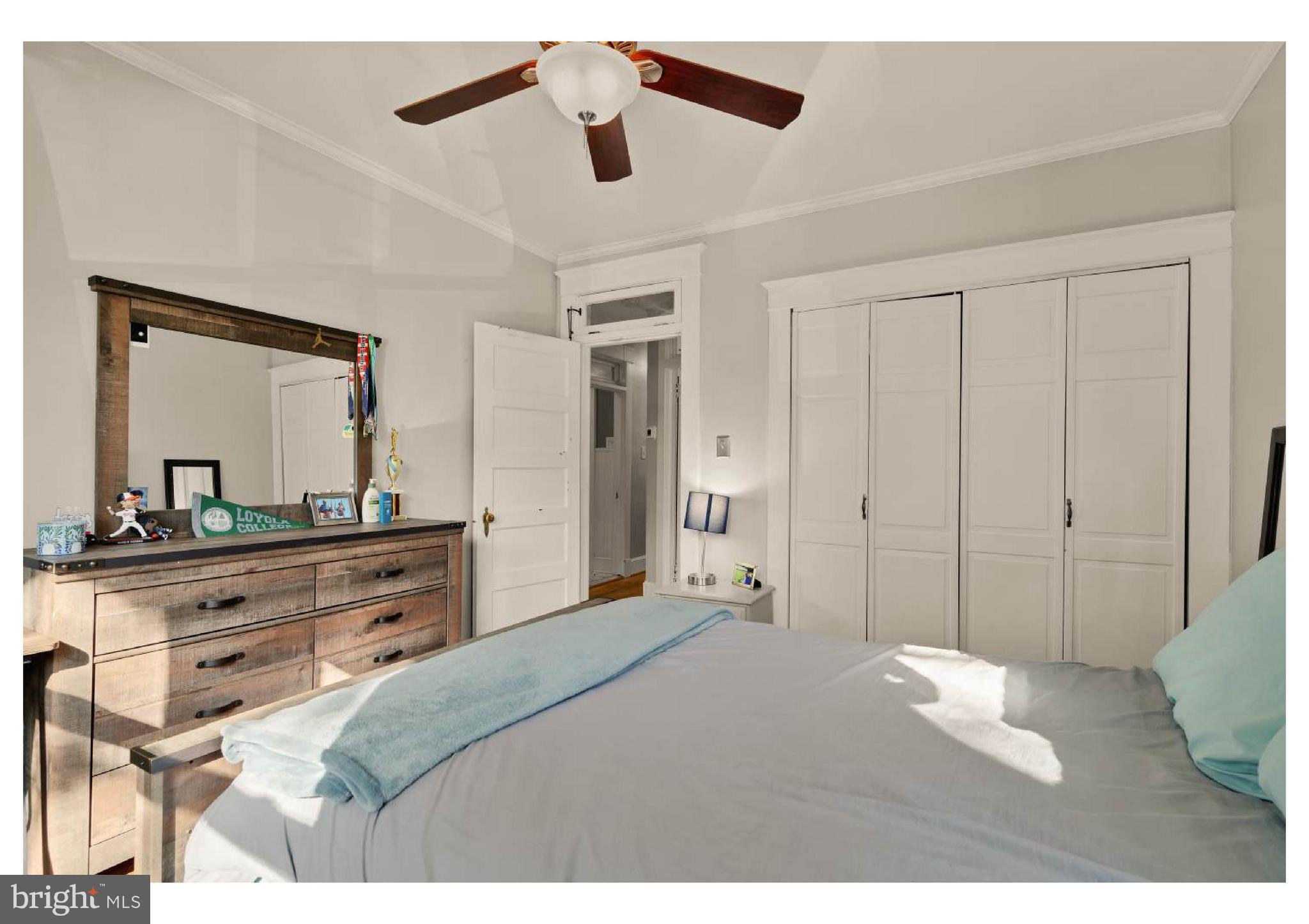 610 St Dunstans Road Baltimore, MD 21212 - Photo 27 of 44 a bedroom with a bed and a mirror on dresser