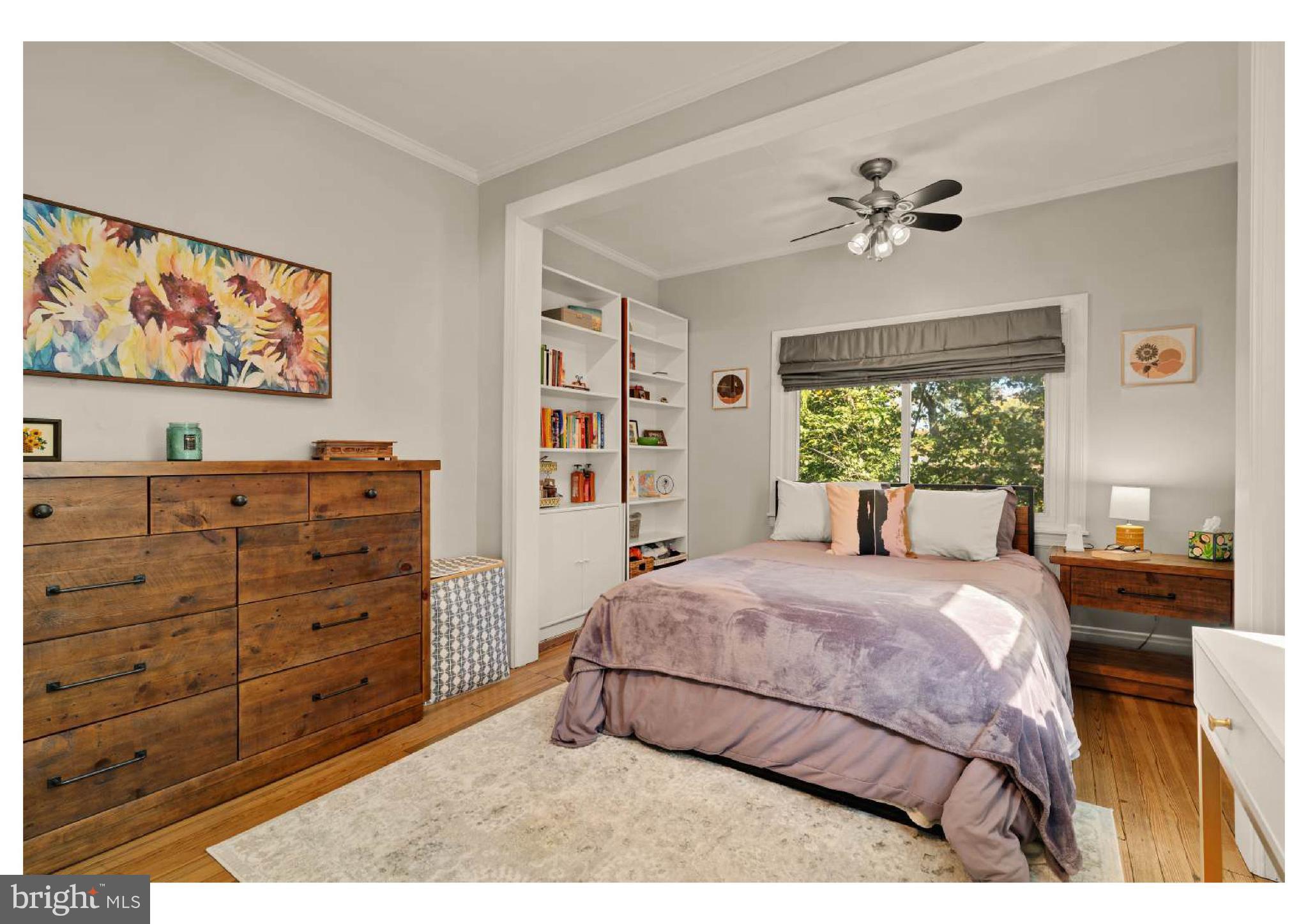 610 St Dunstans Road Baltimore, MD 21212 - Photo 30 of 44 a bedroom with a bed and a painting on the wall