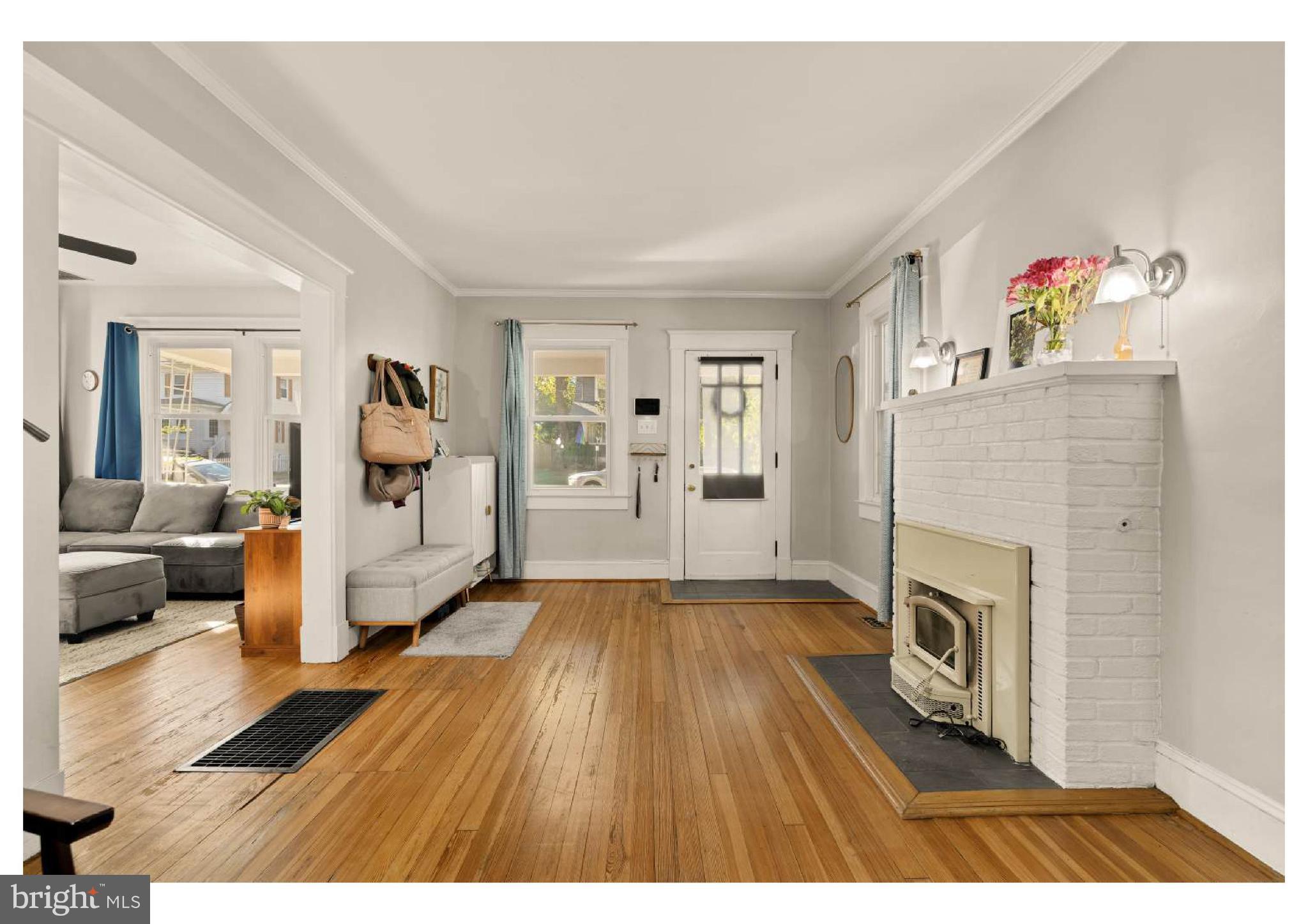 610 St Dunstans Road Baltimore, MD 21212 - Photo 9 of 44 a living room with furniture and a fireplace
