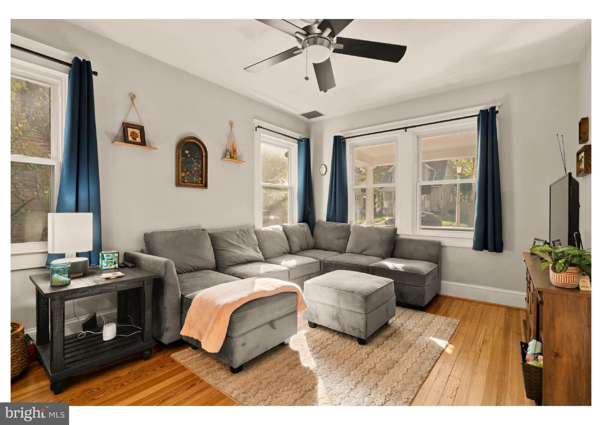 610 St Dunstans Road Baltimore, MD 21212 - Photo 10 of 44 a living room with furniture and a flat screen tv