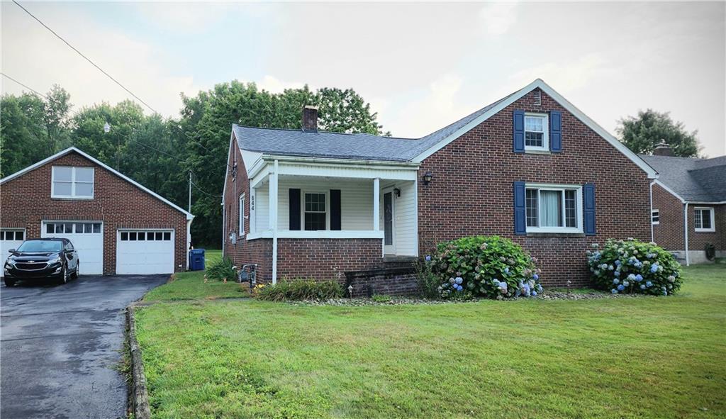 844 Rose Stop Road New Castle, PA 16101 - Photo 1 of 28 a front view of a house with garden