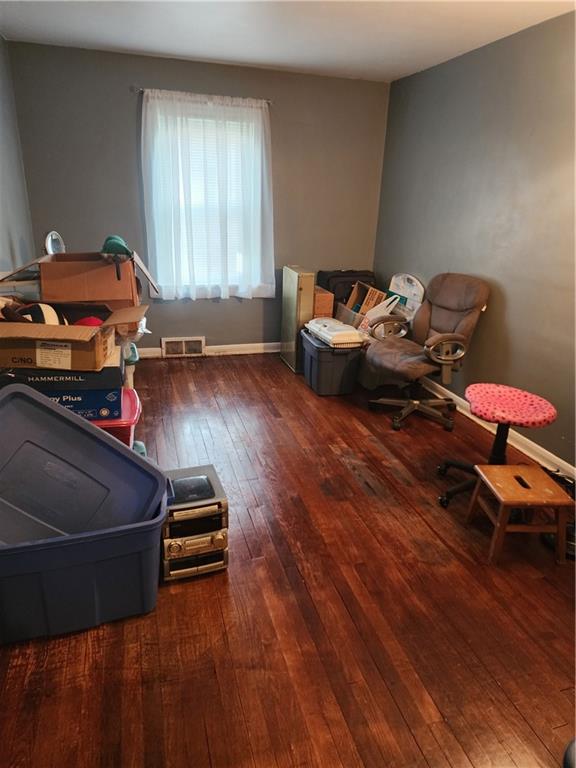 844 Rose Stop Road New Castle, PA 16101 - Photo 11 of 28 a living room with furniture and a wooden floor