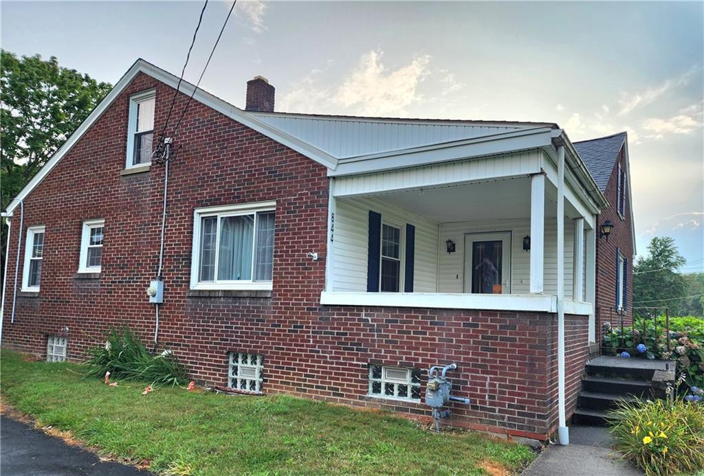844 Rose Stop Road New Castle, PA 16101 - Photo 2 of 28 a front view of a house with garden