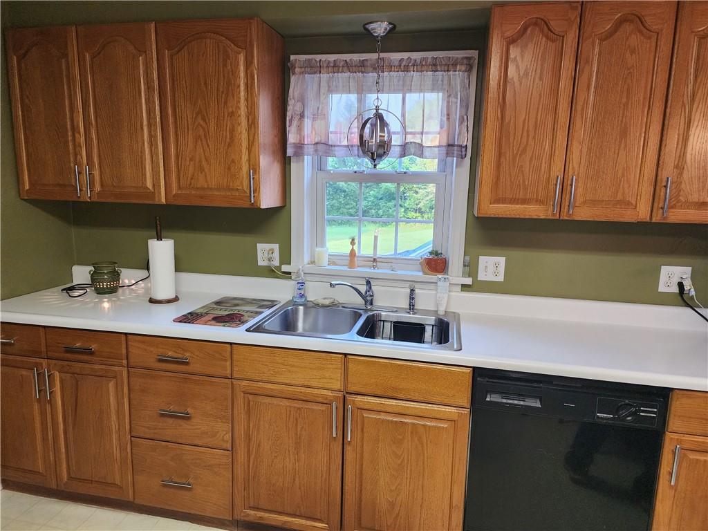 844 Rose Stop Road New Castle, PA 16101 - Photo 5 of 28 a kitchen with stainless steel appliances granite countertop white cabinets sink and a granite counter top