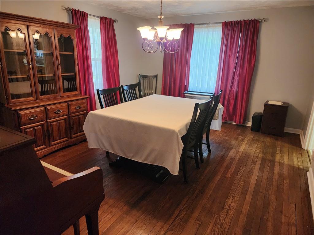 844 Rose Stop Road New Castle, PA 16101 - Photo 6 of 28 a bed sitting in a bedroom next to a window