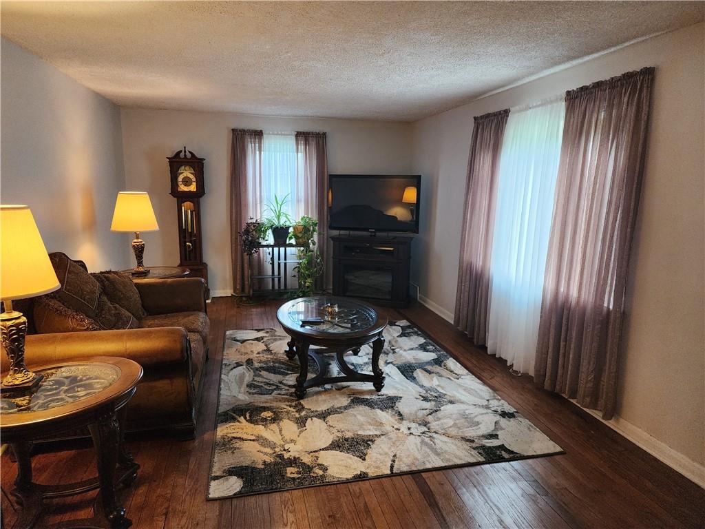 844 Rose Stop Road New Castle, PA 16101 - Photo 8 of 28 a living room with furniture and a flat screen tv