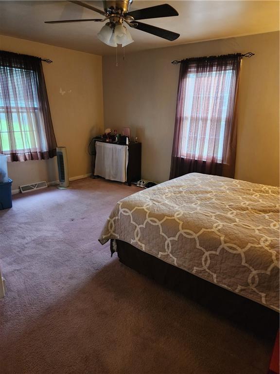 844 Rose Stop Road New Castle, PA 16101 - Photo 10 of 28 a bedroom with a bed and window