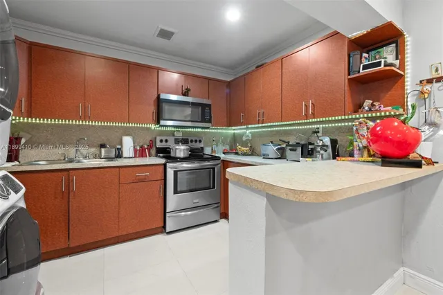 a kitchen with a stove and a microwave