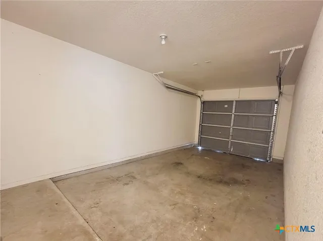 an empty room with a empty space and a window