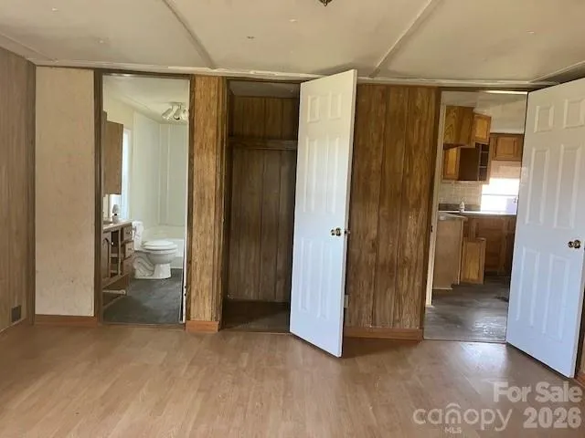 a view of a bathroom with a glass door and a bathroom