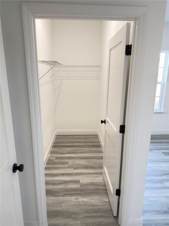 2703 Southwest 162nd Street Road Ocala, FL 34473 - Photo 21 of 39 a view of a hallway with wooden floor and entryway