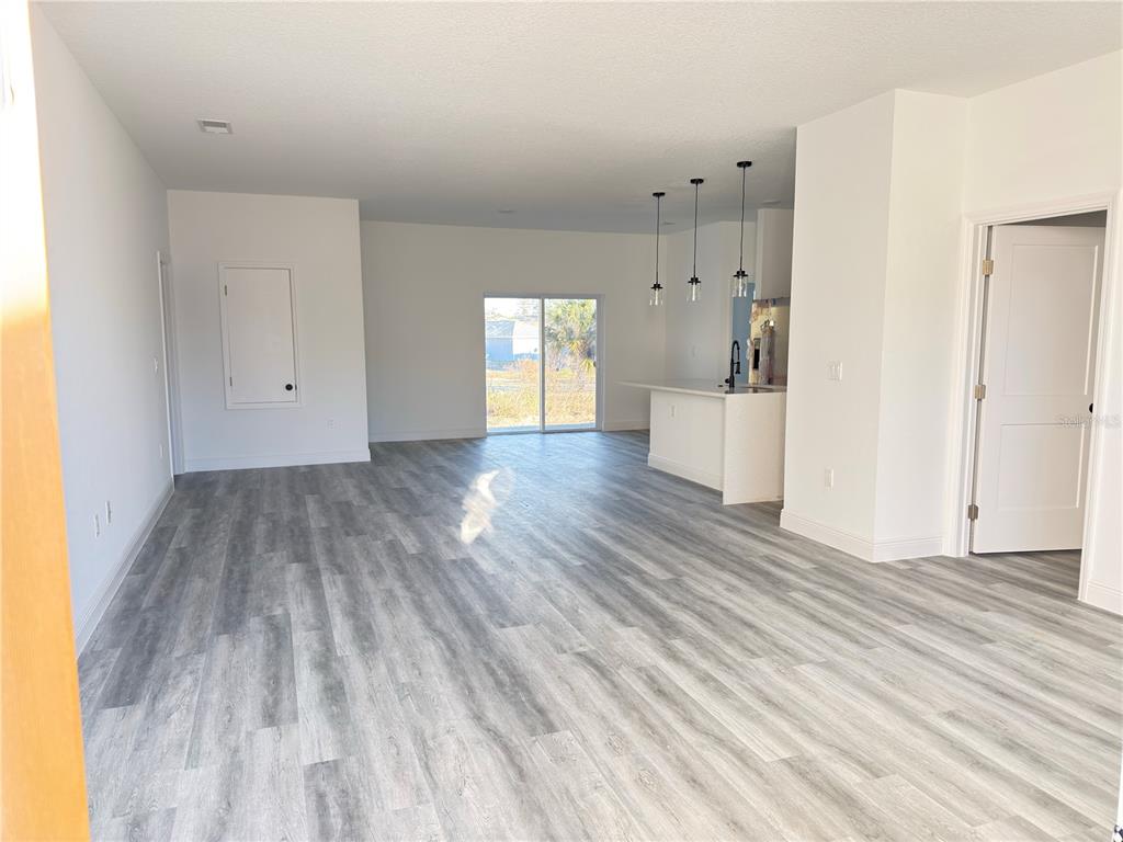 2703 Southwest 162nd Street Road Ocala, FL 34473 - Photo 3 of 39 a view of empty room with wooden floor