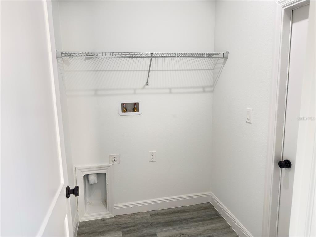 2703 Southwest 162nd Street Road Ocala, FL 34473 - Photo 32 of 39 a view of small space with racks on the wall