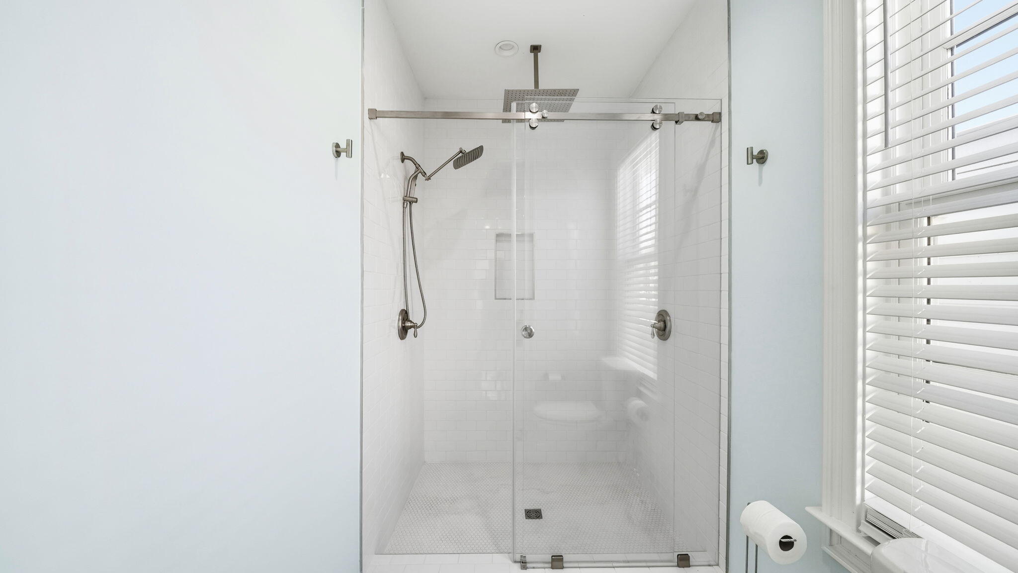 165 Staggerbush Street Freeport, FL 32439 - Photo 29 of 68 a bathroom with a glass shower door