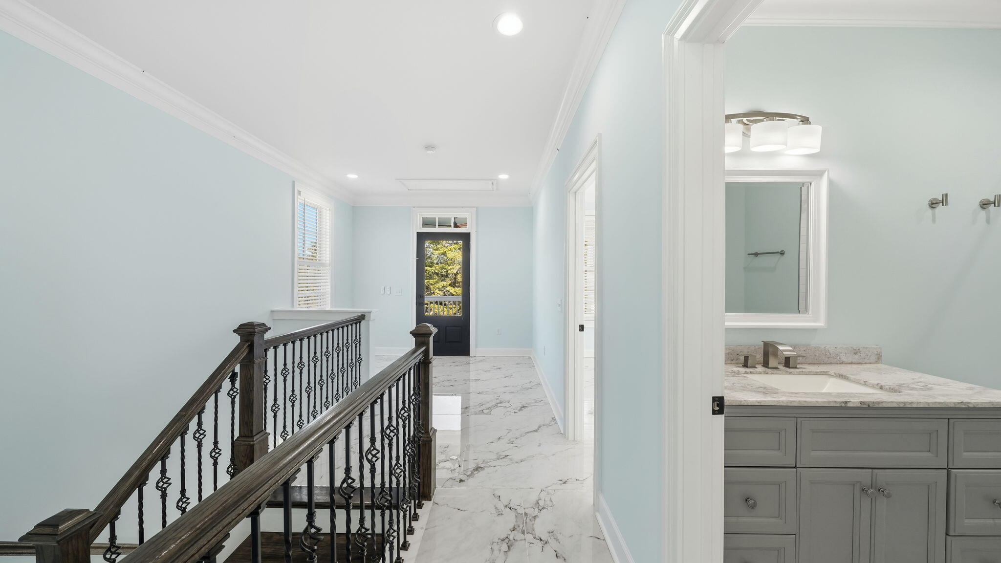 165 Staggerbush Street Freeport, FL 32439 - Photo 35 of 68 a bathroom with a sink and a mirror