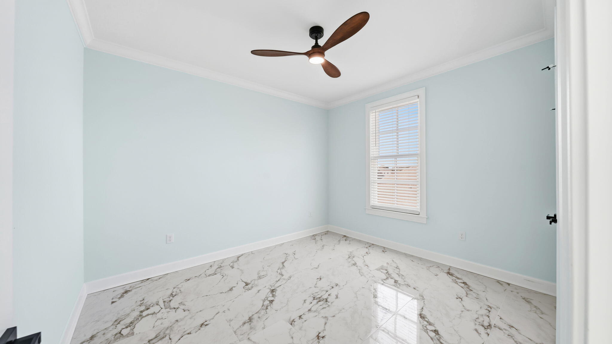 165 Staggerbush Street Freeport, FL 32439 - Photo 39 of 68 an empty room with a window and a ceiling fan