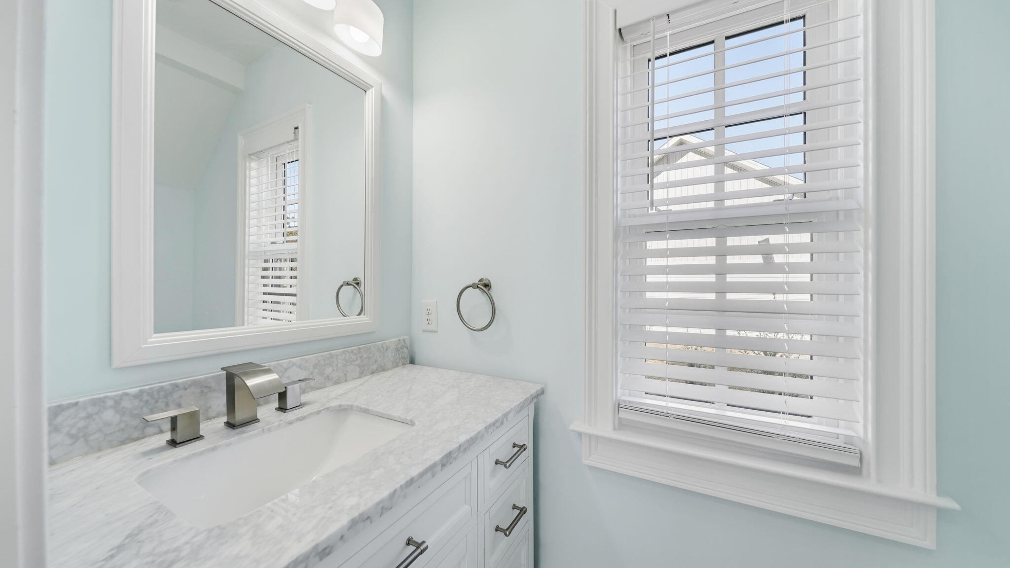 165 Staggerbush Street Freeport, FL 32439 - Photo 41 of 68 a bathroom with a granite countertop sink and a mirror
