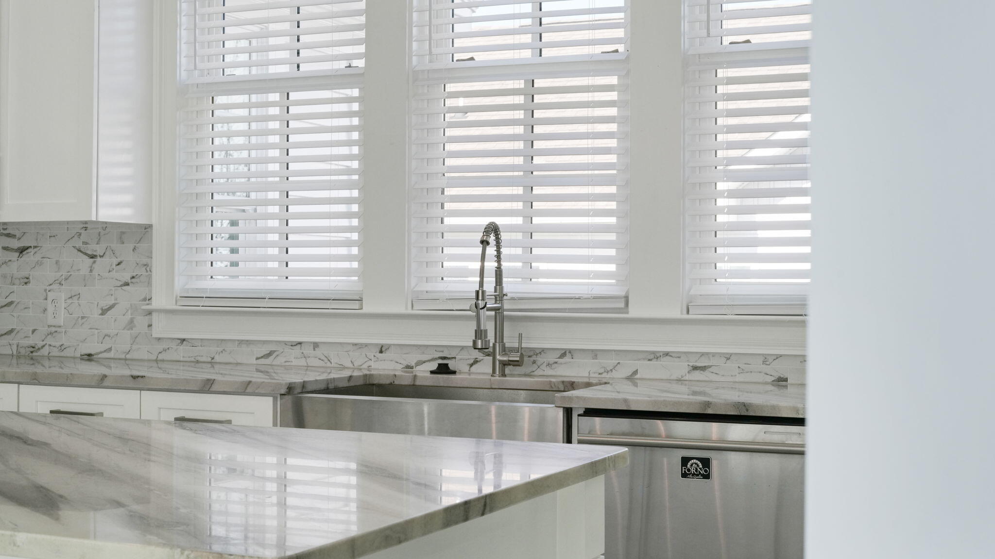 165 Staggerbush Street Freeport, FL 32439 - Photo 65 of 68 a kitchen with granite countertop a sink and a window