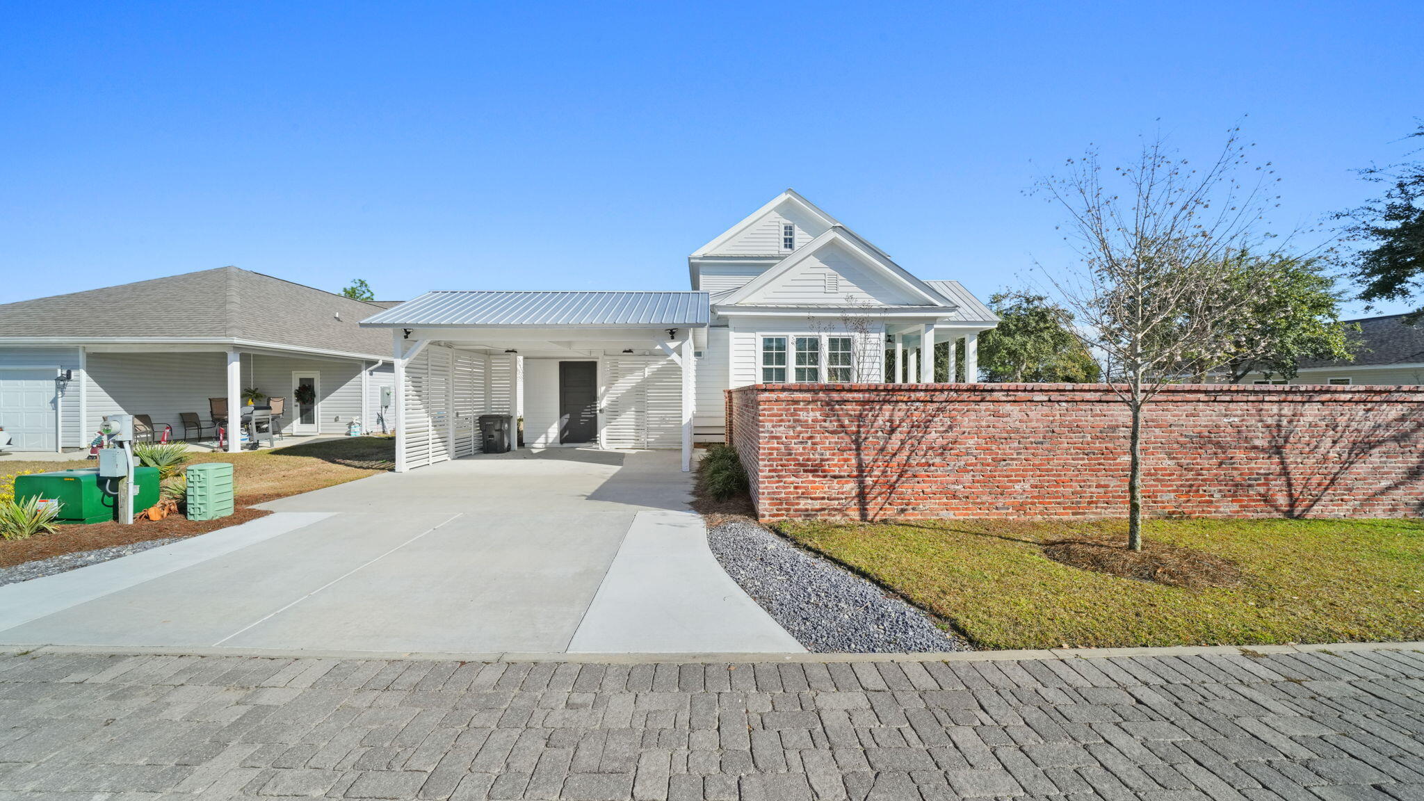 165 Staggerbush Street Freeport, FL 32439 - Photo 8 of 68 a front view of a house with a yard and garage