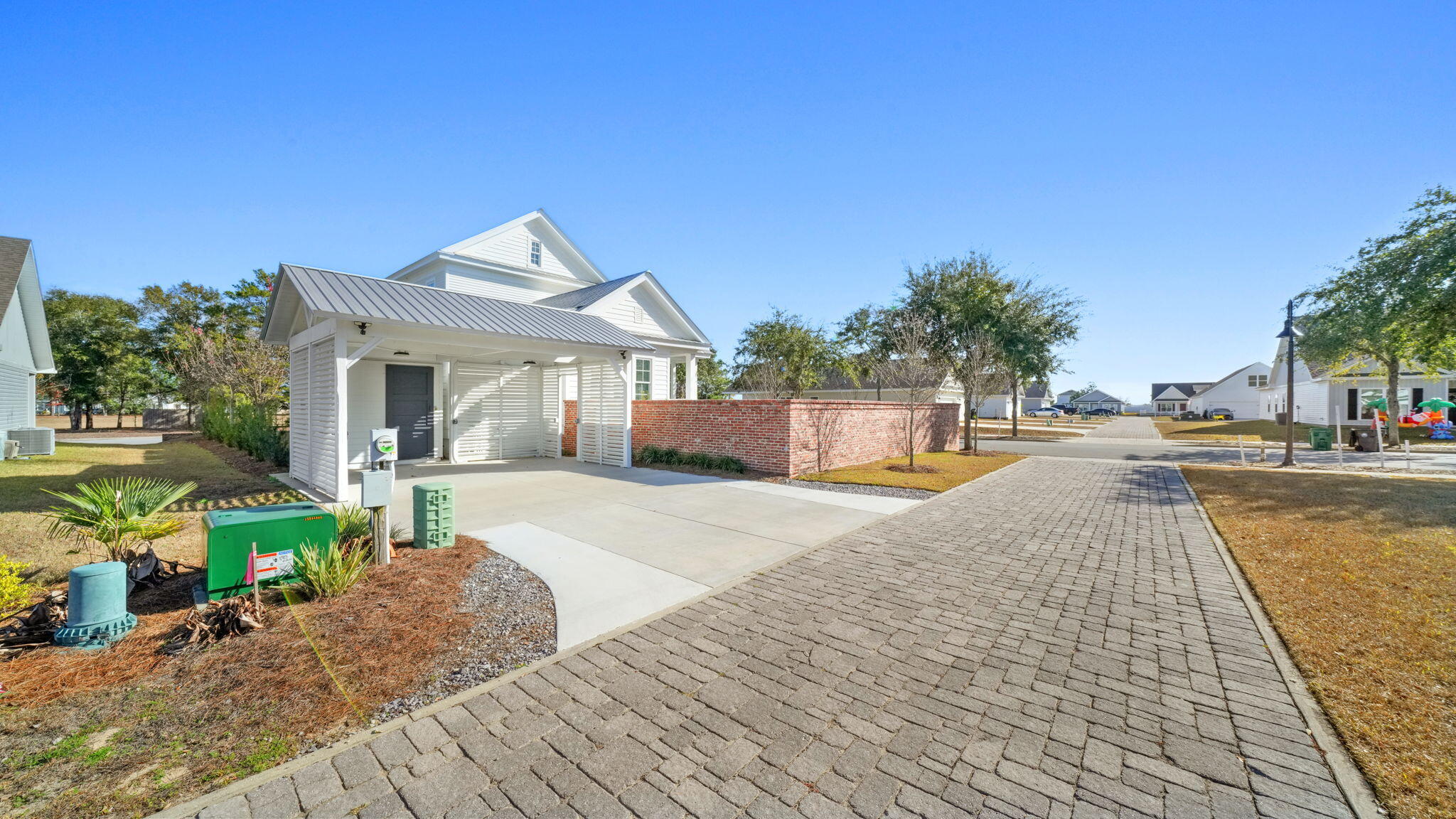 165 Staggerbush Street Freeport, FL 32439 - Photo 10 of 68 a front view of a house with a yard and potted plants