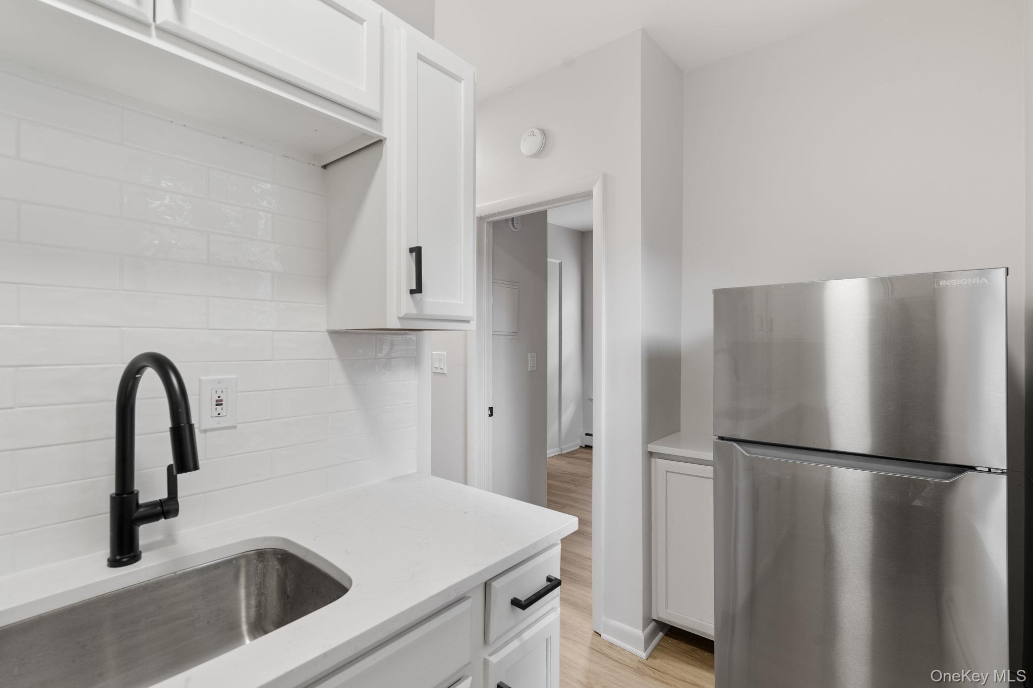 32 North Bridge Street Poughkeepsie, NY 12601 - Photo 12 of 19 a close view of a sink and refrigerator