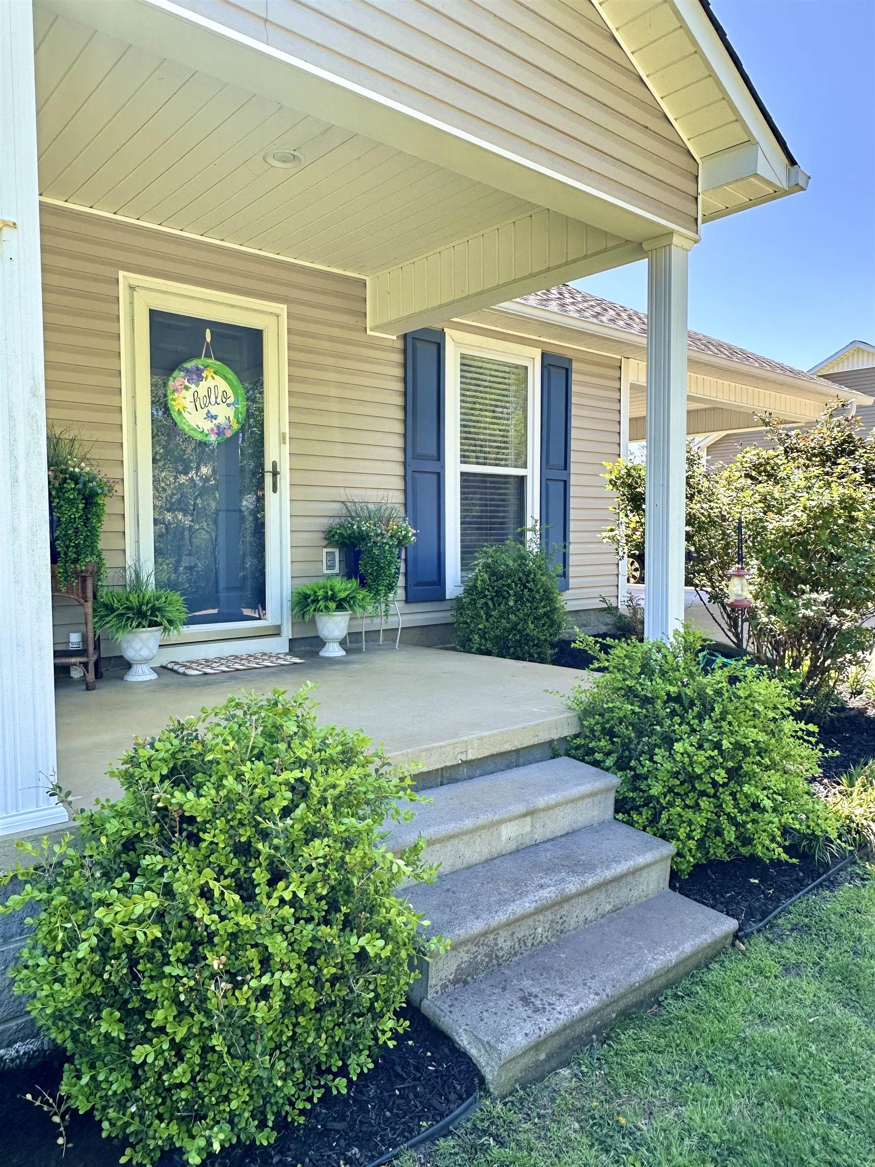 View of exterior entry with a porch