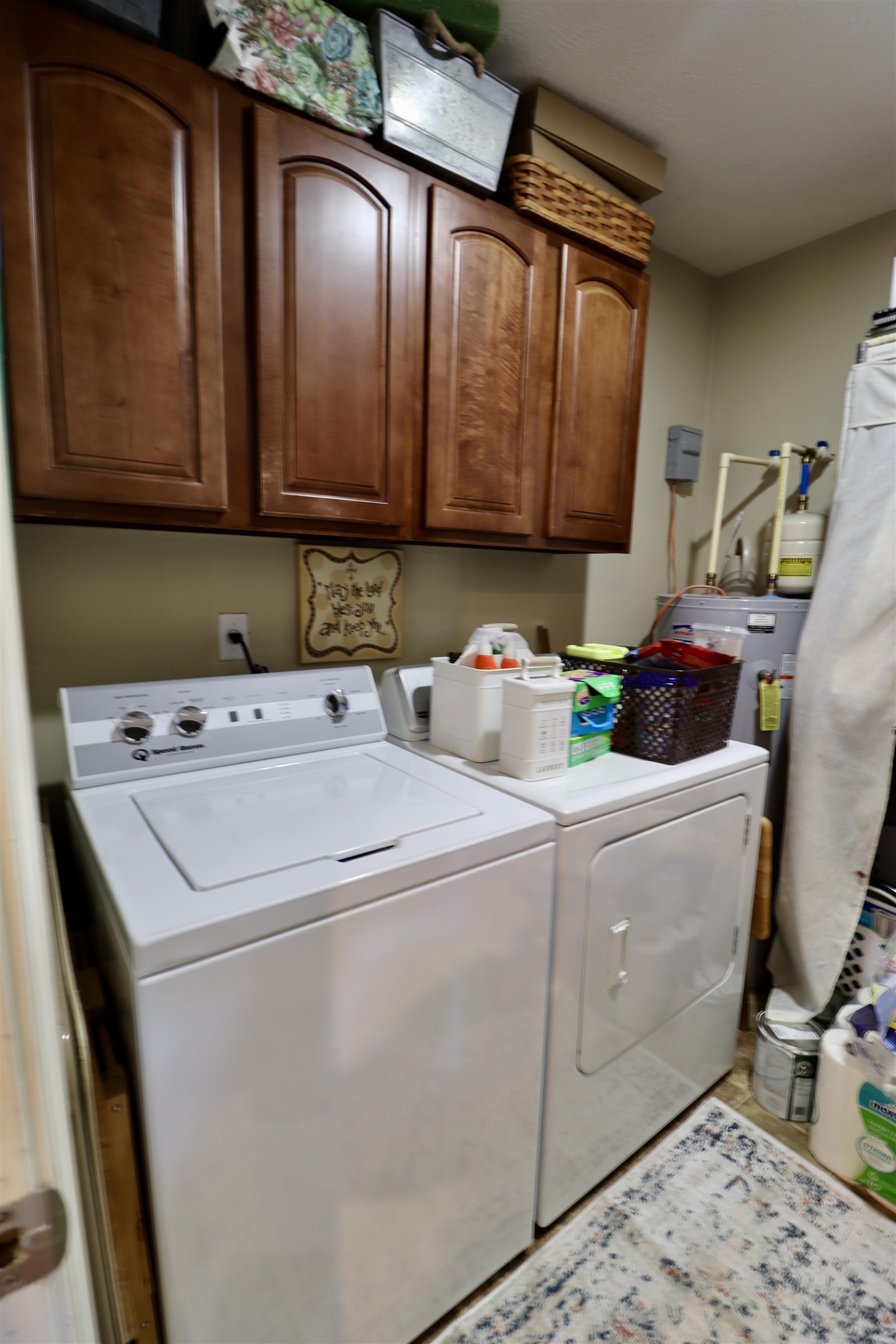 228 Edgewood Drive Adamsville, TN 38310 - Photo 25 of 37 Laundry room featuring independent washer and dryer and cabinet space