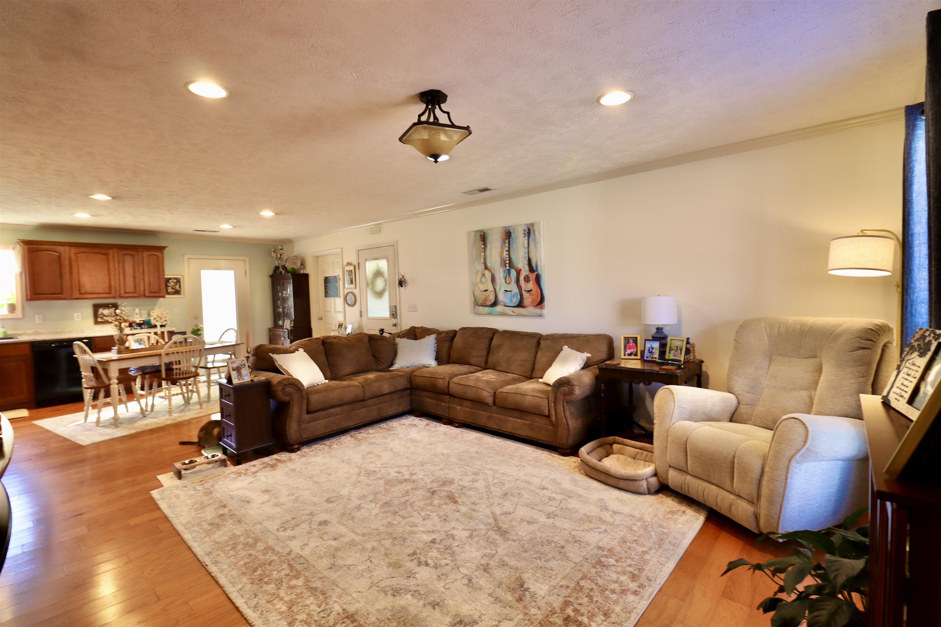 228 Edgewood Drive Adamsville, TN 38310 - Photo 26 of 37 Living area featuring recessed lighting, visible vents, light wood-style flooring, and a textured ceiling